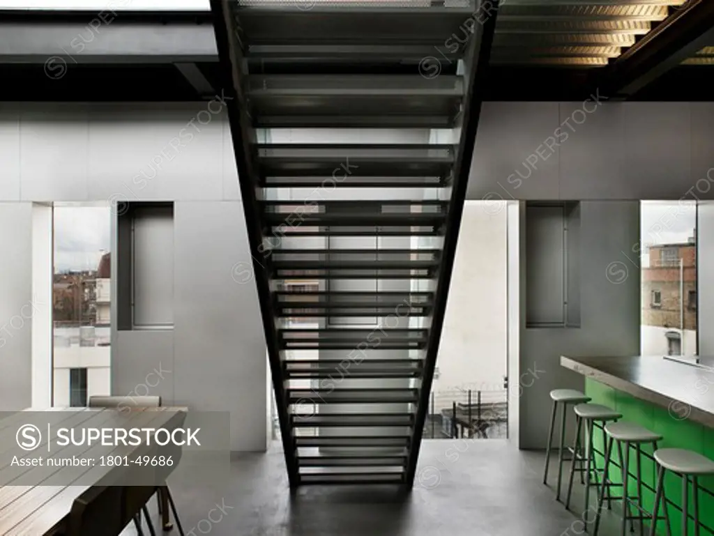 Silverlight, London, United Kingdom, Adjaye Associates, SILVERLIGHT ADJAYE ASSOCIATES LONDON 2010 VIEW OF KITCHEN AND DINING AREA WITH STAIRS LEADING TO TOP FLOOR