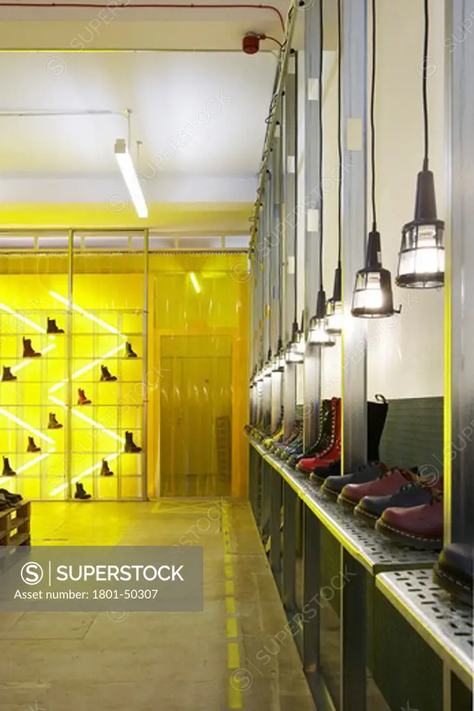 Dr Martens Pop up Store Spitalfields London, London, United Kingdom, Campaign Design, DR MARTEN POP-UP STORE CAMPAIGN DESIGN SPITALFIELDS LONDON UK 2009. INTERIOR SHOT SHOWING THE INNOVATIVE PRODUCT DISPLAYS AND BOLD YELLOW LIGHTING