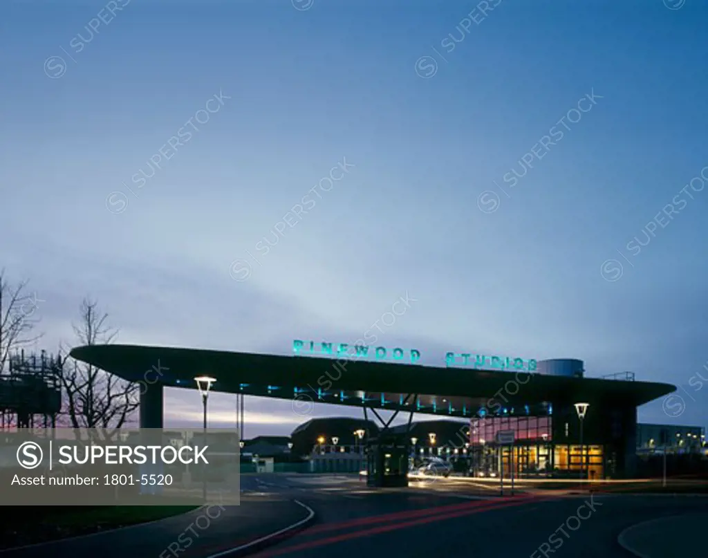 PINEWOOD FILM STUDIOS GATE HOUSE AND 007 STAGE EXT, PINEWOOD ROAD, BUCKINGHAMSHIRE, UNITED KINGDOM, GATE AT NIGHT FROM ROAD, BURLAND TM ARCHITECTS