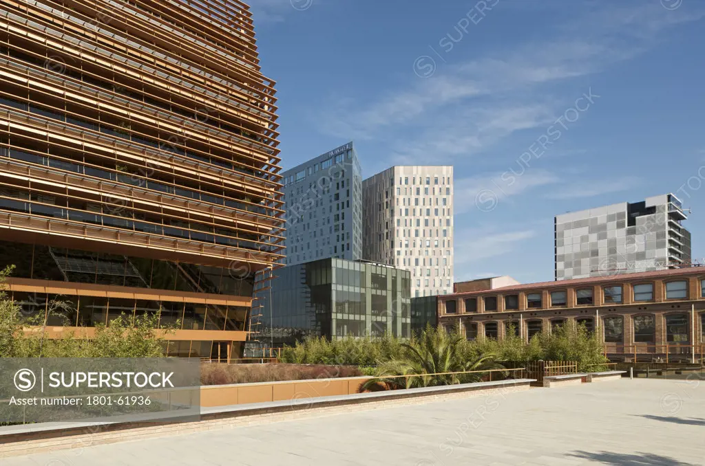 Cmt- Communications Market Commission Hq Ib Barcelona By Batlle I Roig. Latearl View Of Building Showing Old Building