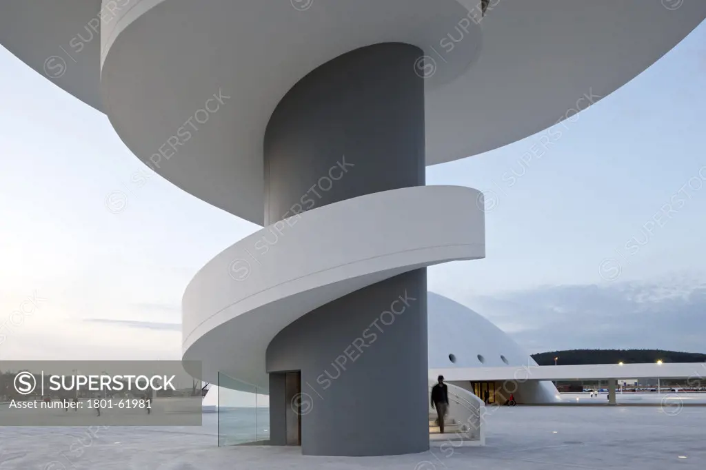 Niemeyer Center In Aviles  Spain  By Oscar Niemeyer. Exterior Evening View Of Tower With Spiral Staircase