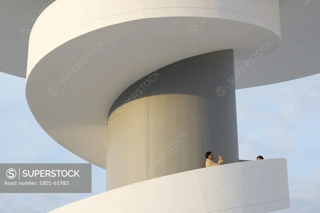 Niemeyer Center In Aviles  Spain  By Oscar Niemeyer. Exterior Evening View Of Tower With Spiral Staircase