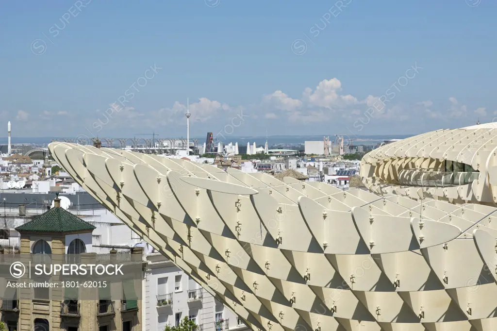Metropol Parasol By J Mayer H Architects In Sevilla Spain. Exterior Detail Of Roofing With Vernacular Building In The Background