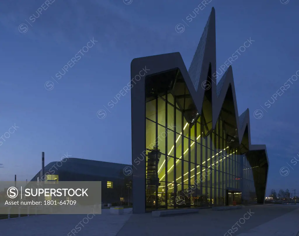 Glasgow Riverside Museum, Zaha Hadid Architects, 2011, Night Time Exterior Wide View Of Riverside Facade