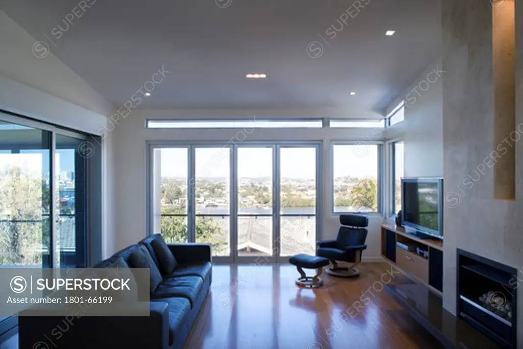 Biscoe Wilson Architects, Brisbane, Queensland, Australia, Private Residence, In Brisbane Bay, Shot Of Siting Room With Fire Place And Sofa With Views Of The Harbour