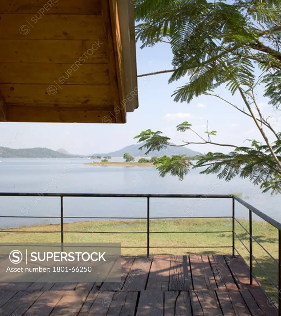 Holiday Cabana, Maduru Oya, Sri Lanka, Damith Premathilake Architecture, Lake House Using Shipping Container And Timber From Weapon Boxes For Materials And Railway Sleepers. Detail Of A Section Of The Decking On The Frist Floor Balcony Of The Cabin With Views Out To The Lakes And Distent Hills