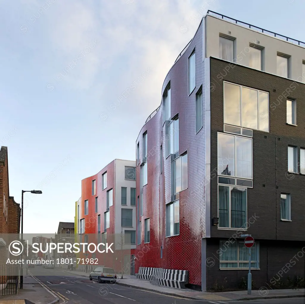 Brandon Street Housing, London, United Kingdom. Architect Metaphorm, 2012. General streets cape of ceramic clad housing facade.