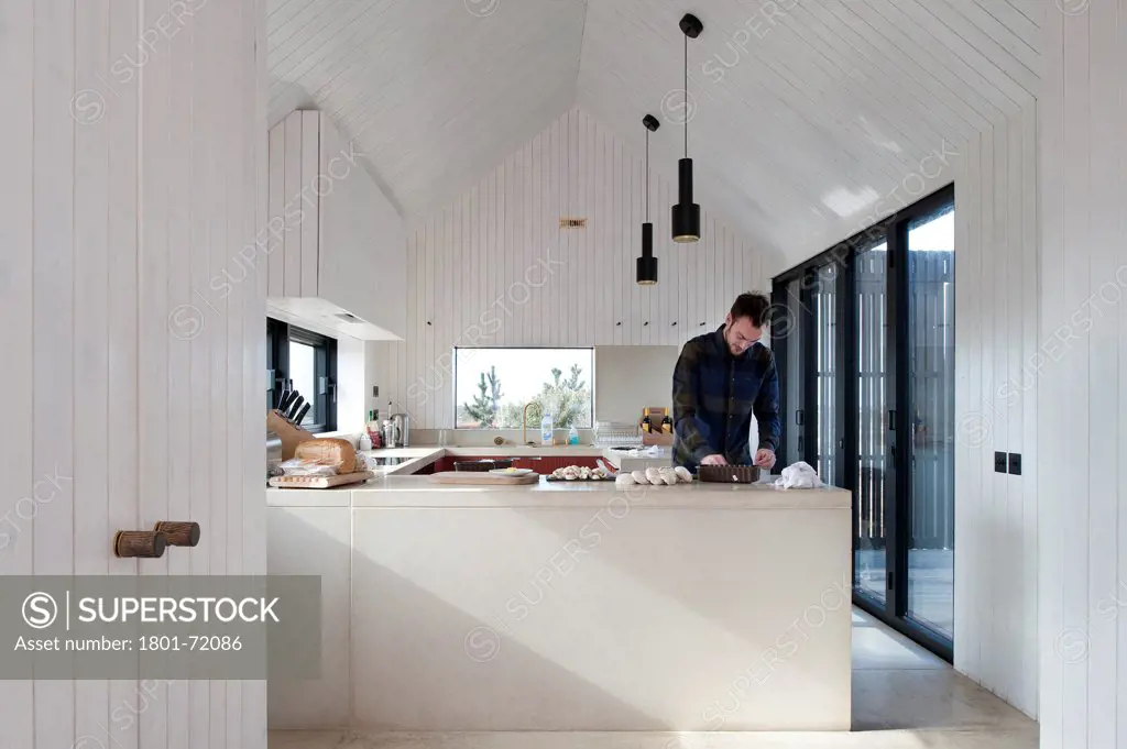 Shingle House, Dungeness, United Kingdom. Architect Nord Architecture, 2011. Kitchen.
