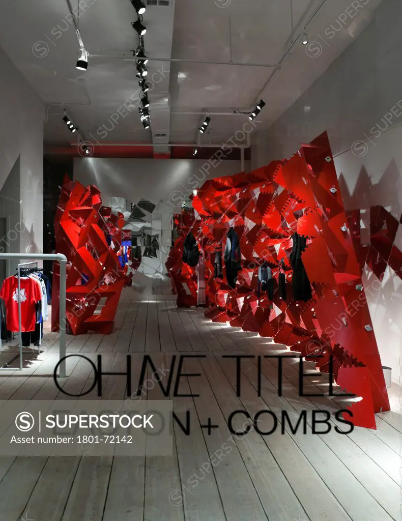 Boffo Building Fashion, New York, United States. Architect Easton Combs Architects, 2011. View from storefront. Digital fabrication, computational scripting, modular wall system, clothing display system. Powder coat red.