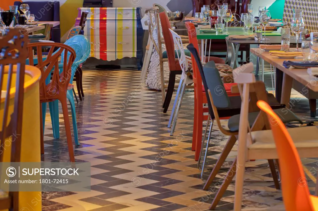 Sketch, London, United Kingdom. Architect Martin Creed, 2012. Colourful restaurant designed by artist Martin Creed. An eclectic mix of mis-matched chairs, tables, glassware, crockery and cutlery.