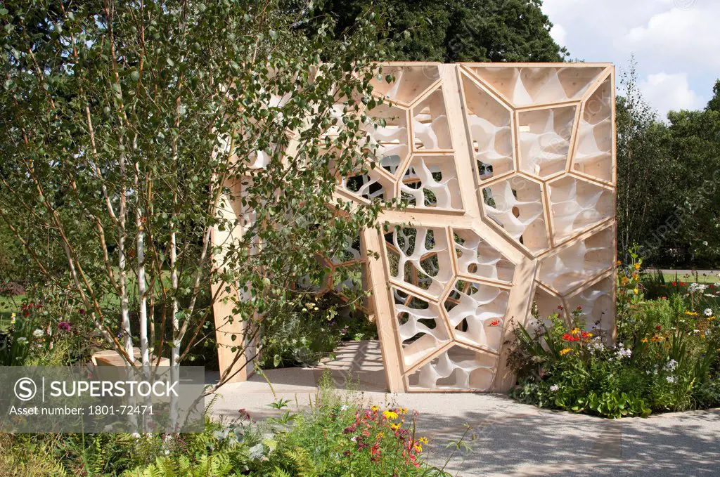 Times Eureka Pavilion, Kew, United Kingdom. Architect NEX, 2011. Exterior framed by silver birches and flower beds.