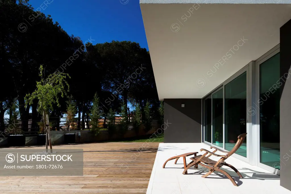 Godiva House, Estoril, Portugal. Architect Empty Space Arquitectos, 2012. Outside view from garden.