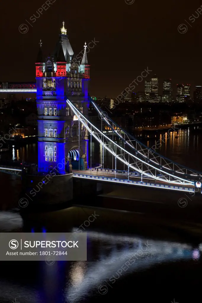 Tower Bridge Re-lighting, London, United Kingdom. Architect Horace Jones, 2012. Detail View of Tower Bridge capturing new lighting system from GLA Building. Red, White & Blue lighting.