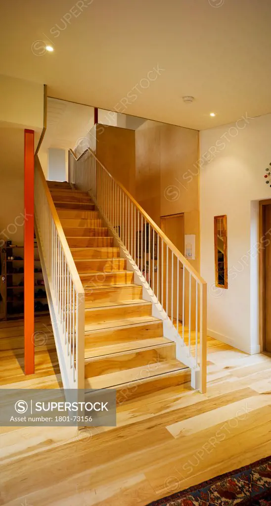 Ballynoe, Dublin, Ireland. Architect McCullough Mulvin, 2006. View of stairs showing timber flooring.