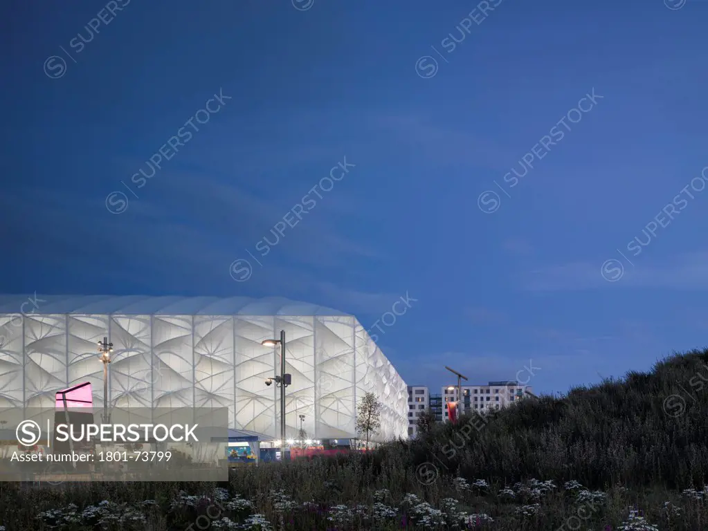 Basketball Arena, London 2012 Olympics, Sports Centre, Europe, United Kingdom,2012, Wilkinson Eyre Architects. Dusk shot with flowers.
