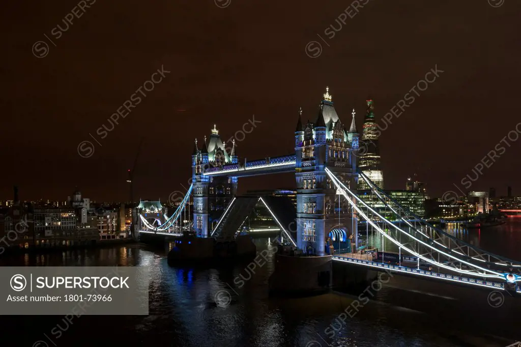 Tower Bridge Re-Lighting, London, United Kingdom. Architect: Horace Jones, 2012. View from the Guoman Hotel with bridge in open position.