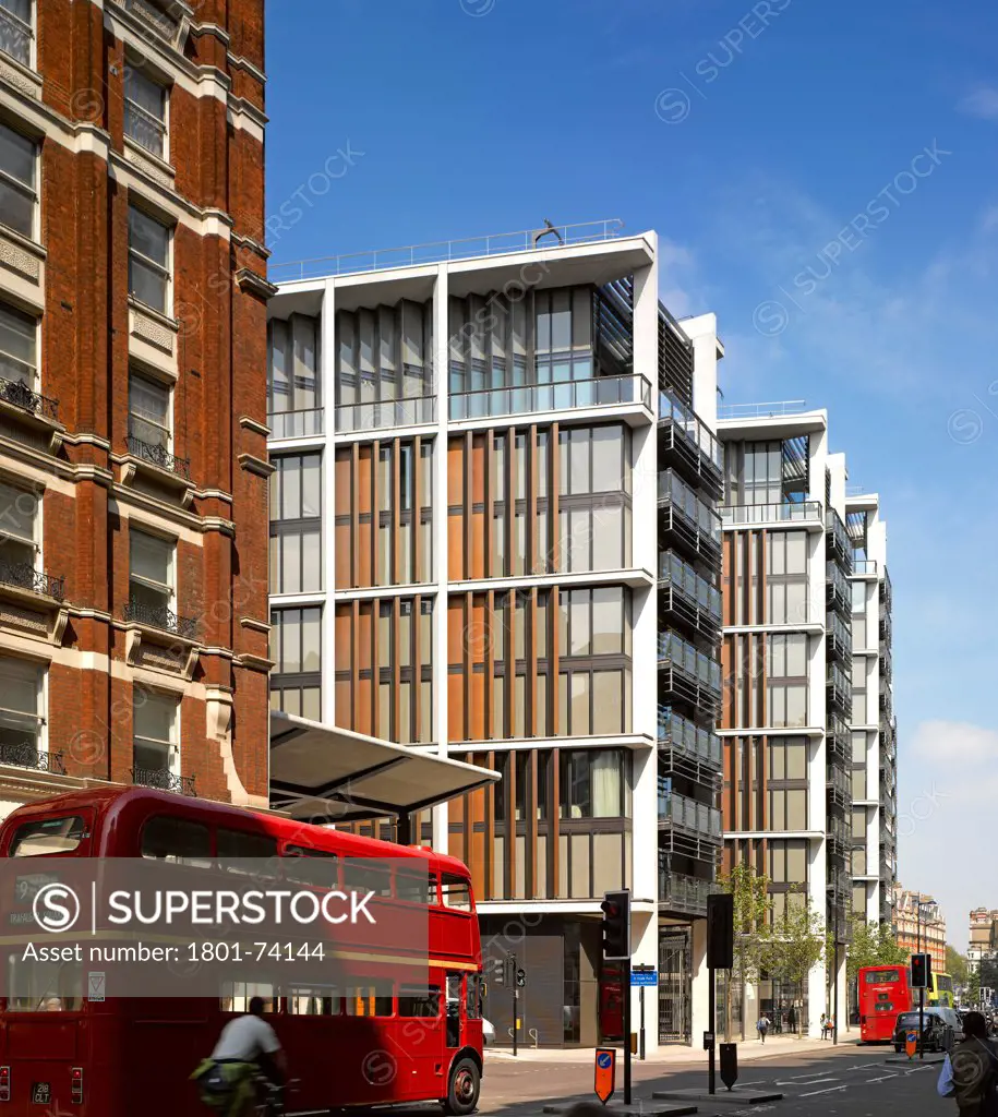 One Hyde Park, London, United Kingdom. Architect: Rogers Stirk Harbour + Partners, 2011. Overall view from Knightsbridge side with routemaster bus.