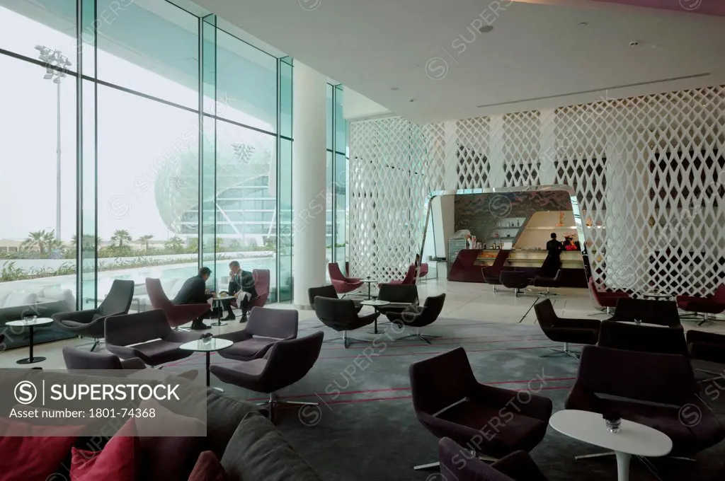 Yas Hotel, Abu Dhabi, United Arab Emirates. Architect: Asymptote, Hani Rashid, Lise Anne Couture, 2010. Lobby with lounge bar.