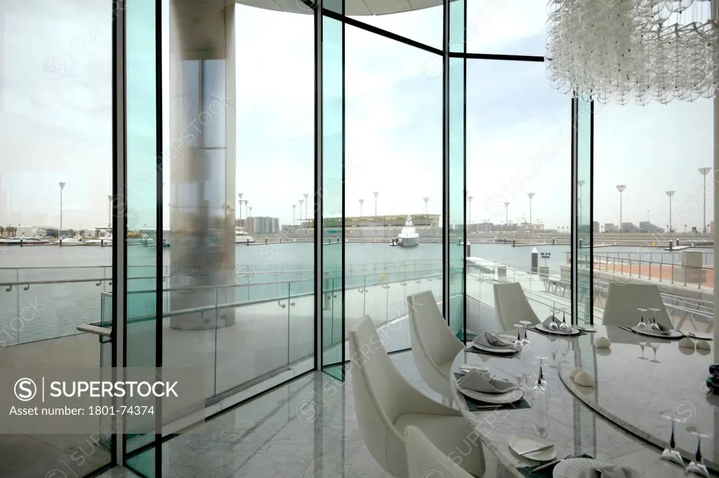Yas Hotel, Abu Dhabi, United Arab Emirates. Architect: Asymptote, Hani Rashid, Lise Anne Couture, 2010. Luxury restaurant looking on the Marina.