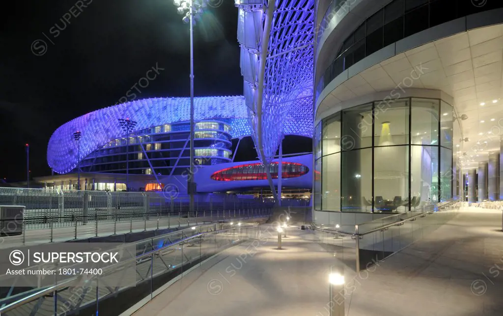 Yas Hotel, Abu Dhabi, United Arab Emirates. Architect: Asymptote, Hani Rashid, Lise Anne Couture, 2010. Night view of outside deck.