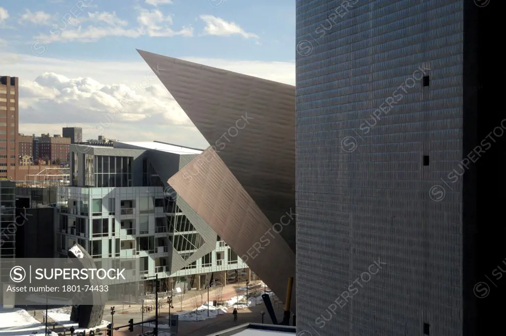 Extension to the Denver Art Museum, Frederic C. Hamilton Building, Denver, United States. Architect: Daniel Libeskind, 2006. View of the old Museum by Gio Ponti, the extension by Daniel Libeskind, the residences at the museum.