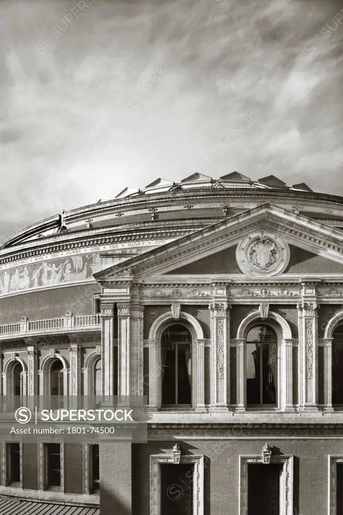 Royal Albert Hall, London, United Kingdom. Architect:  Captain Francis Fowke and Major-General Henry Y.D, 1871. Elevated view of the east facade showing columns, arches, mosaic frieze and wrought-iron dome roof.
