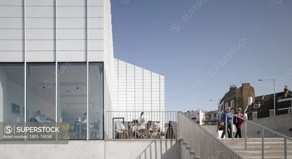 Turner Contemporary Gallery, Margate, United Kingdom. Architect: David Chipperfield Architects Ltd, 2011. West elevation with people in cafe.