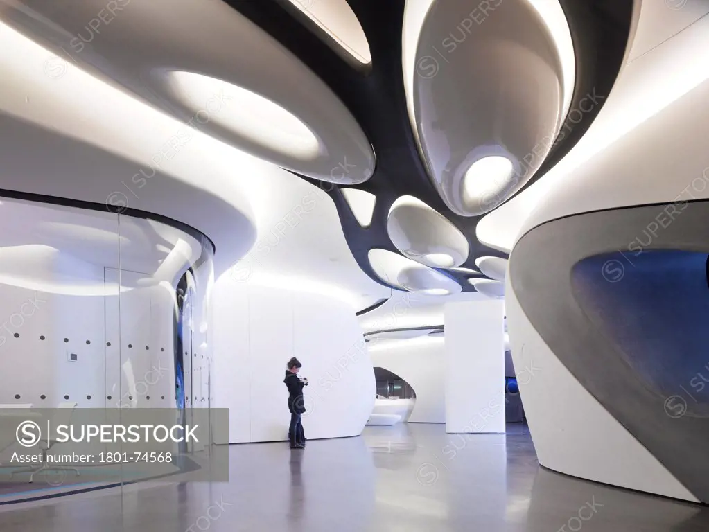 Roca London Gallery, London, United Kingdom. Architect: Zaha Hadid, 2011. Passageway with person.