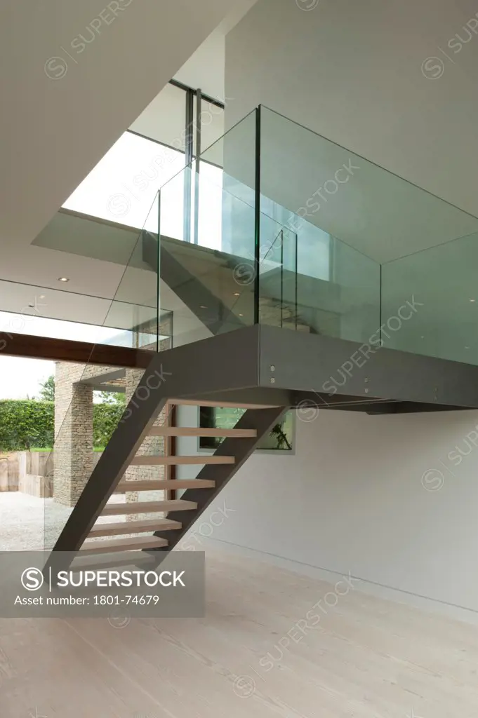 Hurst House, Bourne End, United Kingdom. Architect: John Pardey Architects with Strom Architects, 2011. View of main stair to entrance.