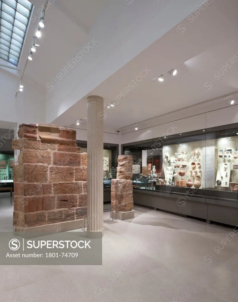 Egypt Galleries, Ashmolean Museum, Oxford, United Kingdom. Architect: Rick Mather Architects, 2011. View of Christian Levett Family Gallery with wall mounted display case.