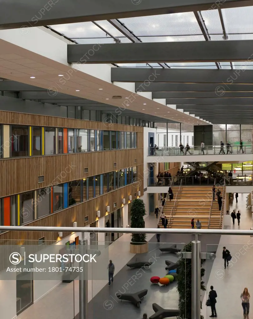 Stanley Park High School, Sutton, United Kingdom. Architect: Haverstock Associates LLP, 2011. Elevated view from 1st floor gallery to atrium.