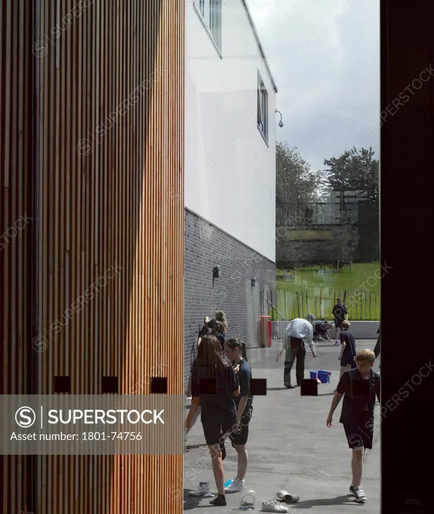 Stanley Park High School, Sutton, United Kingdom. Architect: Haverstock Associates LLP, 2011. Partial view through to schoolyard.