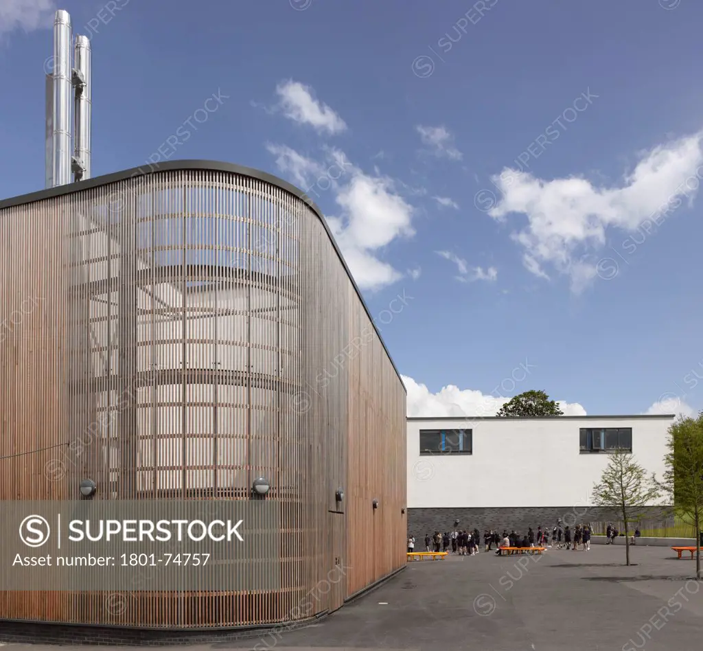 Stanley Park High School, Sutton, United Kingdom. Architect: Haverstock Associates LLP, 2011. View of exterior, timber clad utility plant.