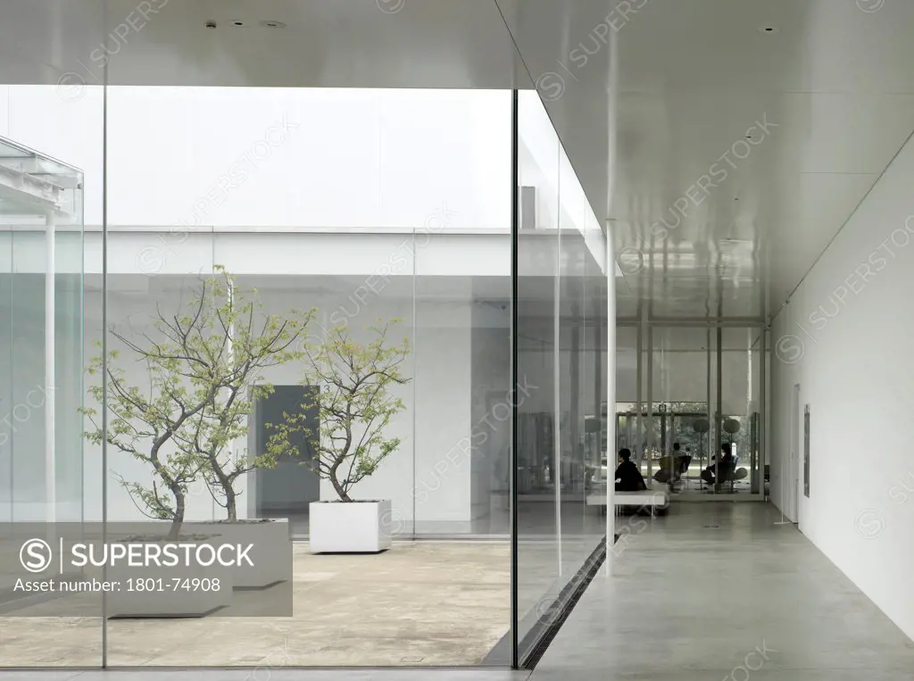 21st Century Museum, Kanazawa, Japan. Architect: SANAA, 2012. Overall interior view showing courtyard.