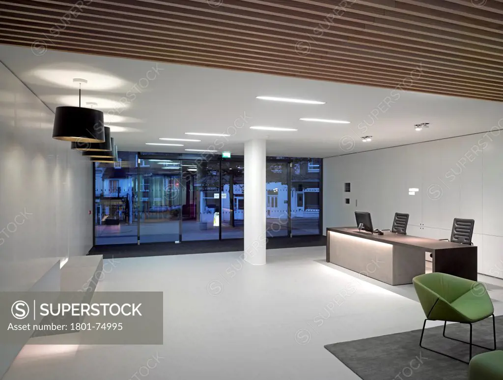 Sovereign House, Brighton, United Kingdom. Architect: Ben Adams Architects, 2012. Interior view showing new reception area at dusk.