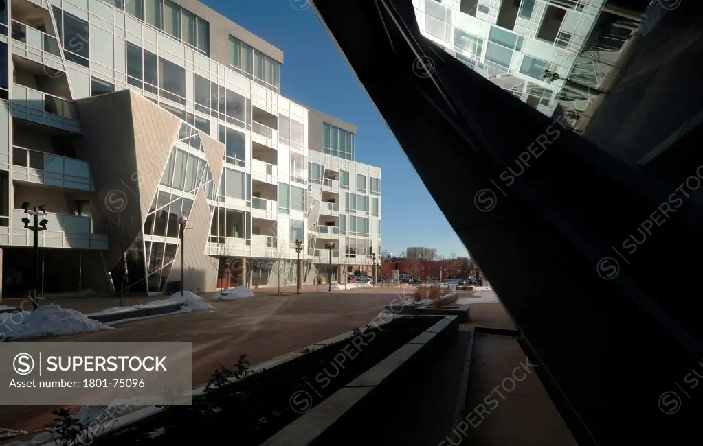 Denver Art Museum Residences, Denver, United States. Architect: Daniel Libeskind and Davis Partnership Architects, 2006. Exterior view with reflection in museum window.