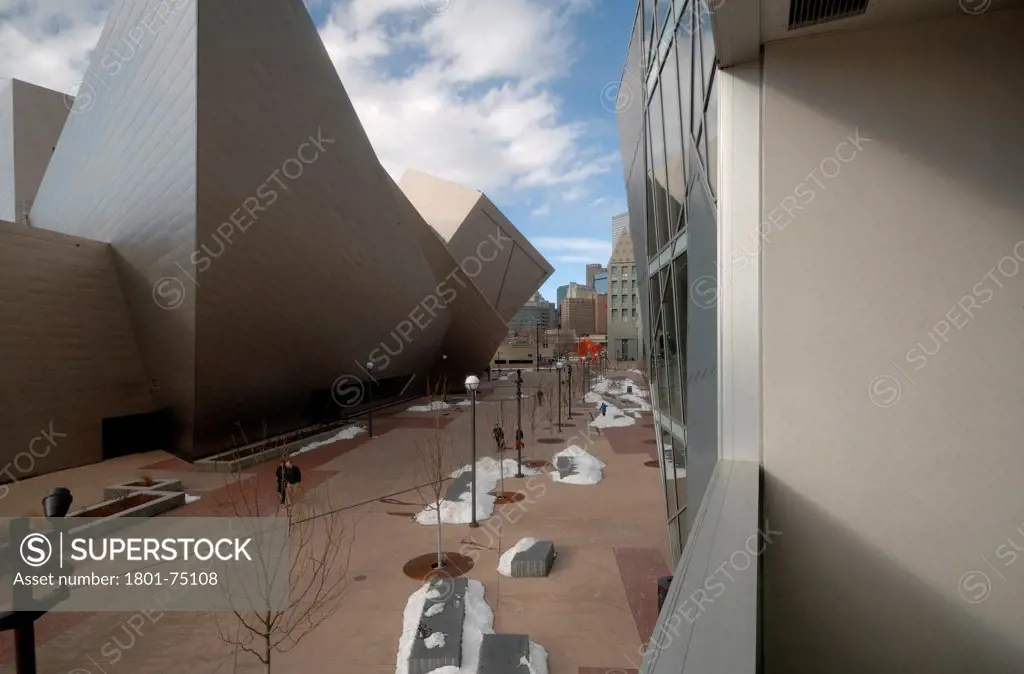 Denver Art Museum Residences, Denver, United States. Architect: Daniel Libeskind and Davis Partnership Architects, 2006. Exterior view through one of the loggias showing the museum.