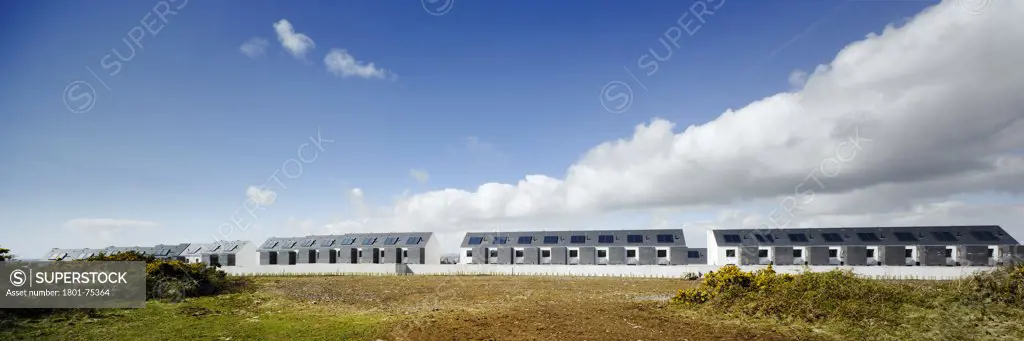 Gleann Bhan, Galway, Ireland. Architect: DTA Architects, 2008. View of housing development from surrounding landscape.