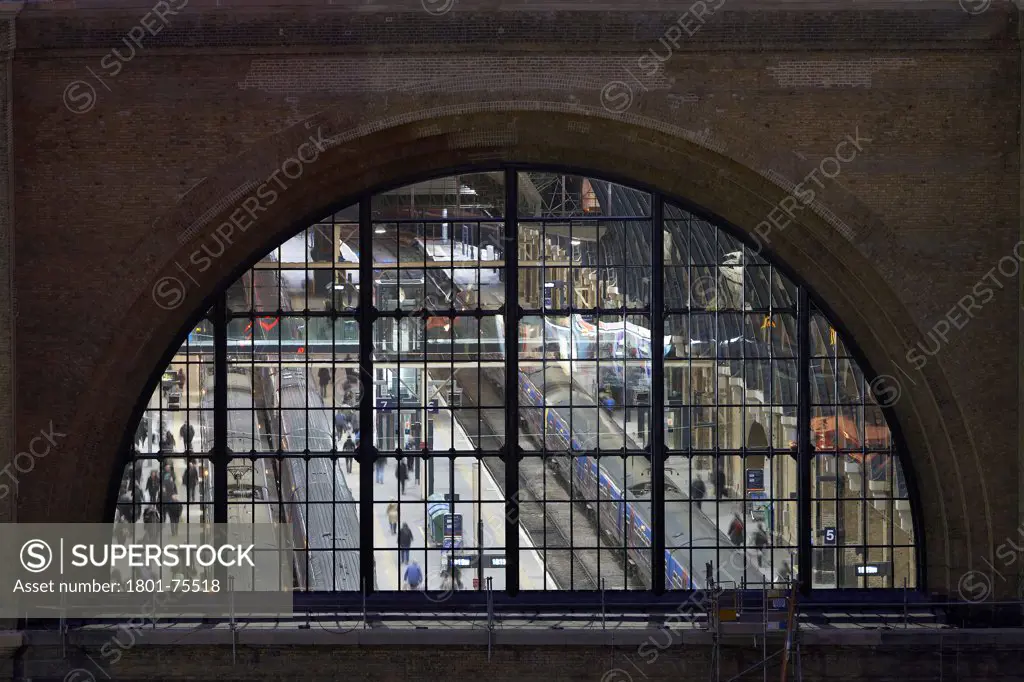 King's Cross Station, Railway Station, Europe, United Kingdom, , 2012, John McAslan & Partners. View to platforms through arched window.