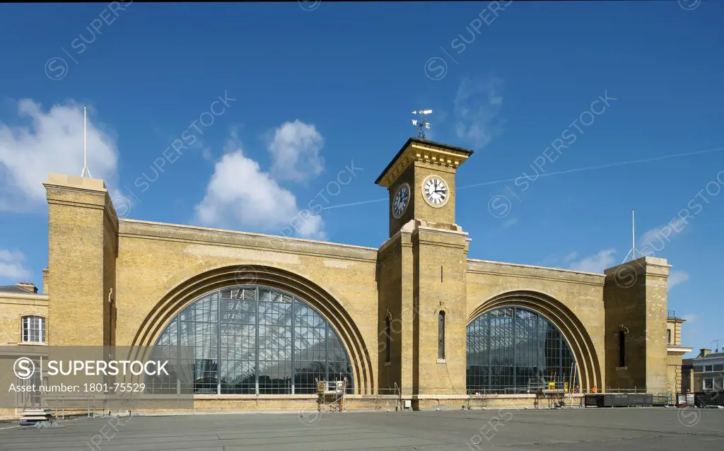 King's Cross Station, Railway Station, Europe, United Kingdom, , 2012, John McAslan & Partners. Exterior of station showing clock tower and two arched windows.