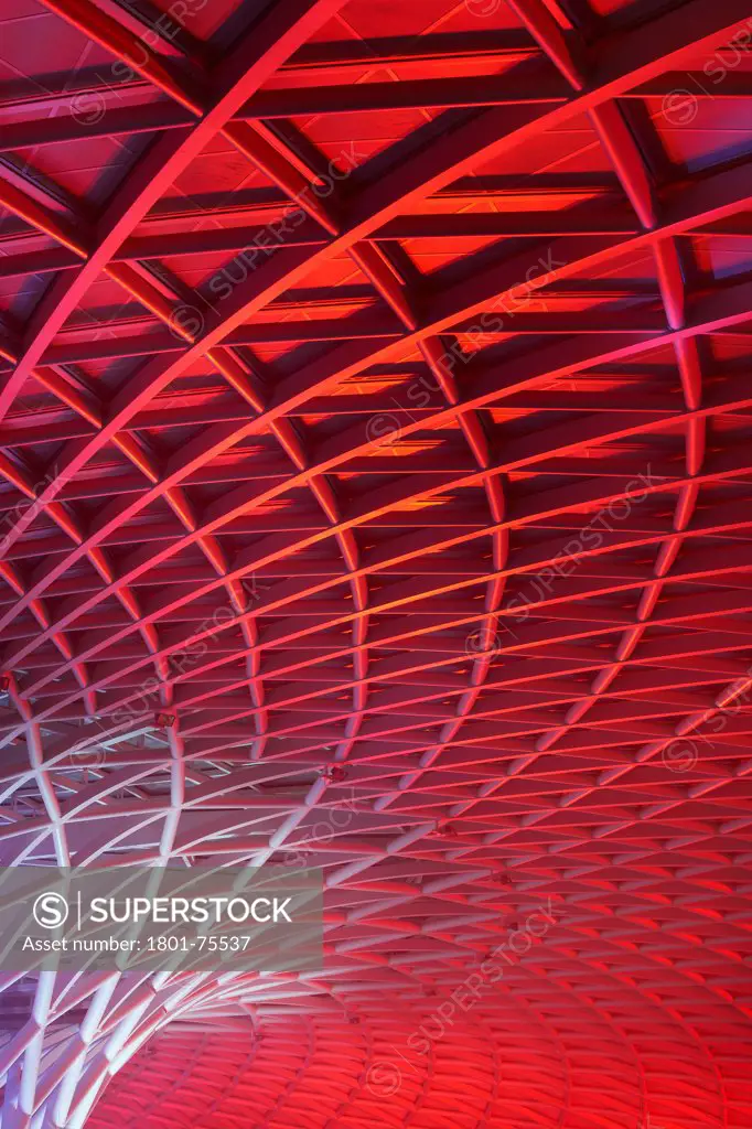 King's Cross Station, Railway Station, Europe, United Kingdom, , 2012, John McAslan & Partners. View of Western Concourse roof with red lighting.