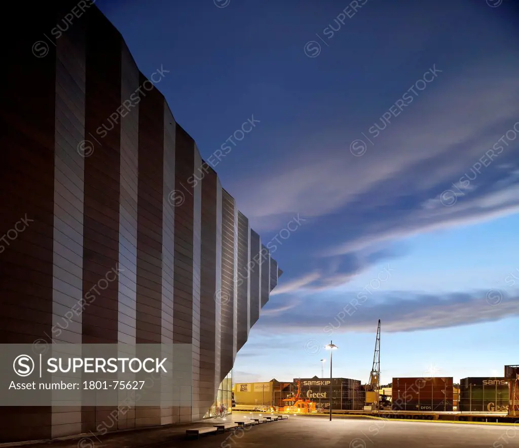 Kilden Performing Arts Centre, Concert Hall, Europe, Norway, , 2011, ALA Architects. View of side elevation at dusk towards cargo.