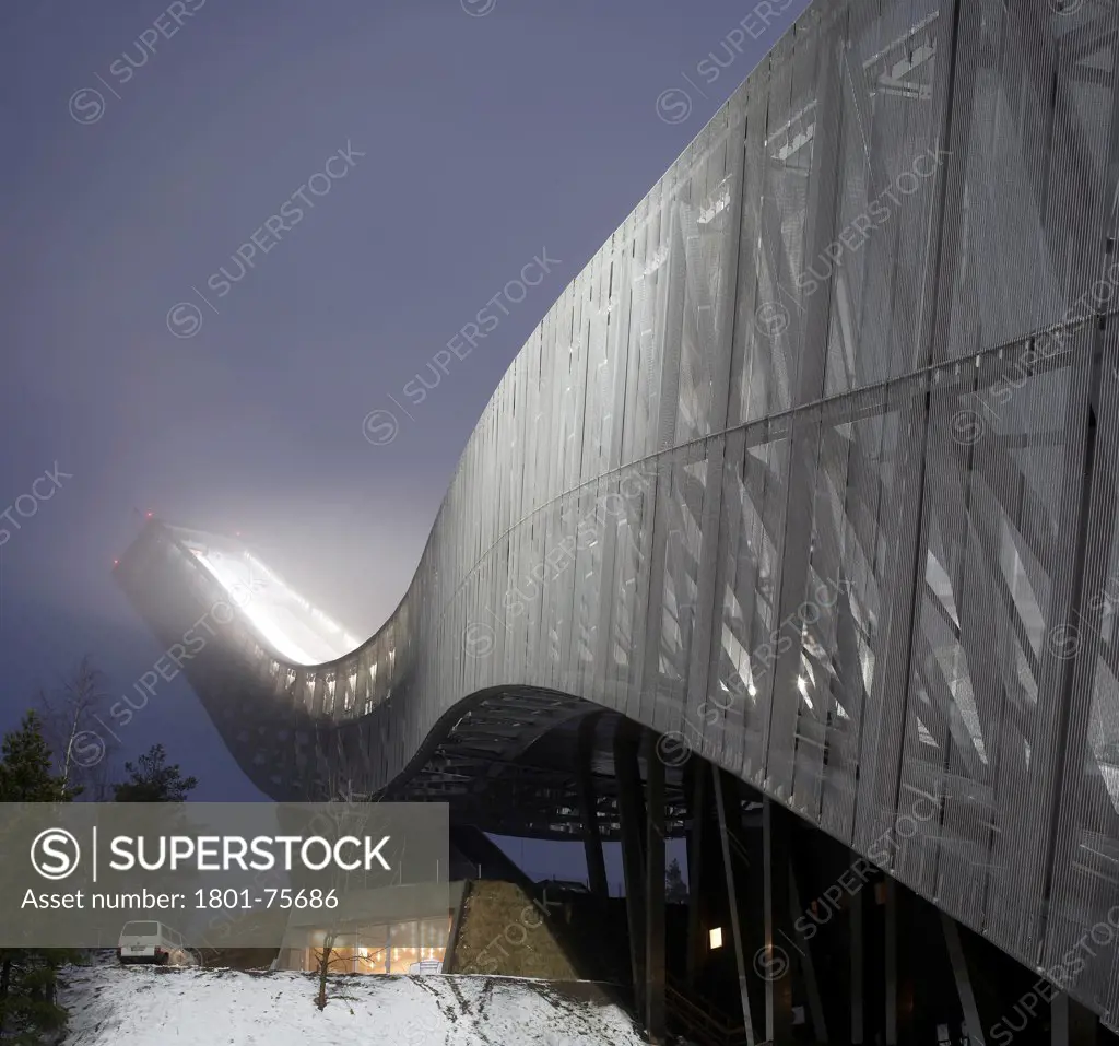 Holmenkollen Ski Jump, Ski Jump, Europe, Norway, , 2011, JDS Architects. View looking up at jump at dusk in the fog.