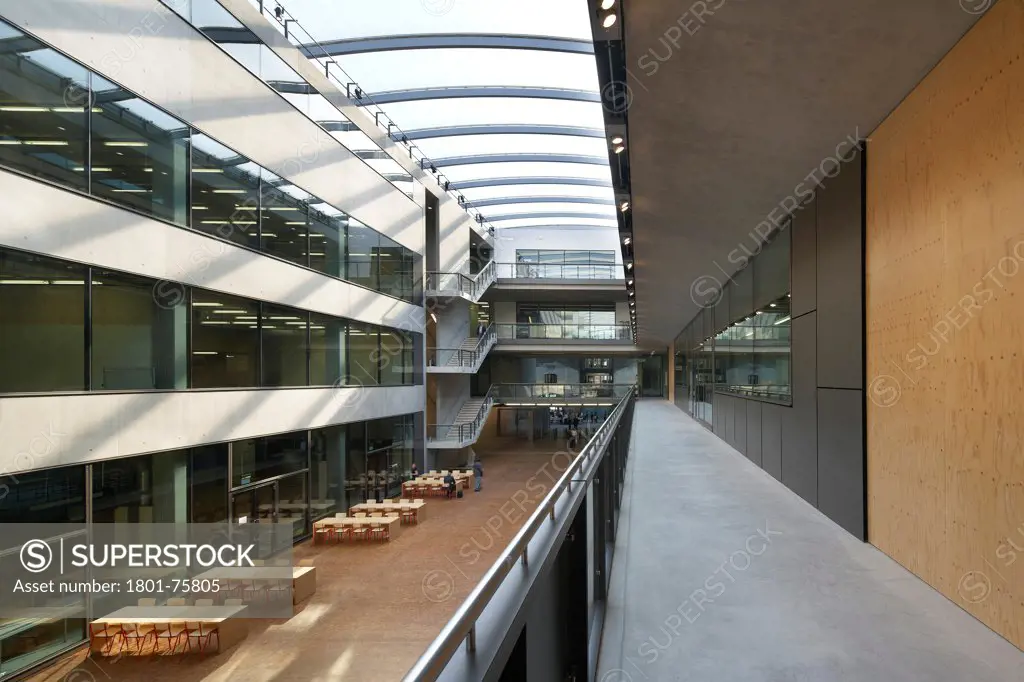 Central Saint Martins, London, United Kingdom. Architect: Stanton Williams, 2011. View of atrium from walkway.