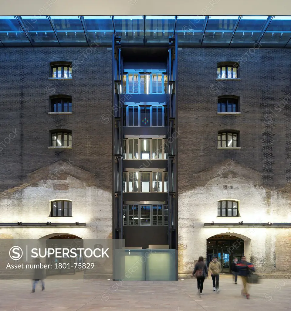 Central Saint Martins, London, United Kingdom. Architect: Stanton Williams, 2011. Lift shaft and brick wall.