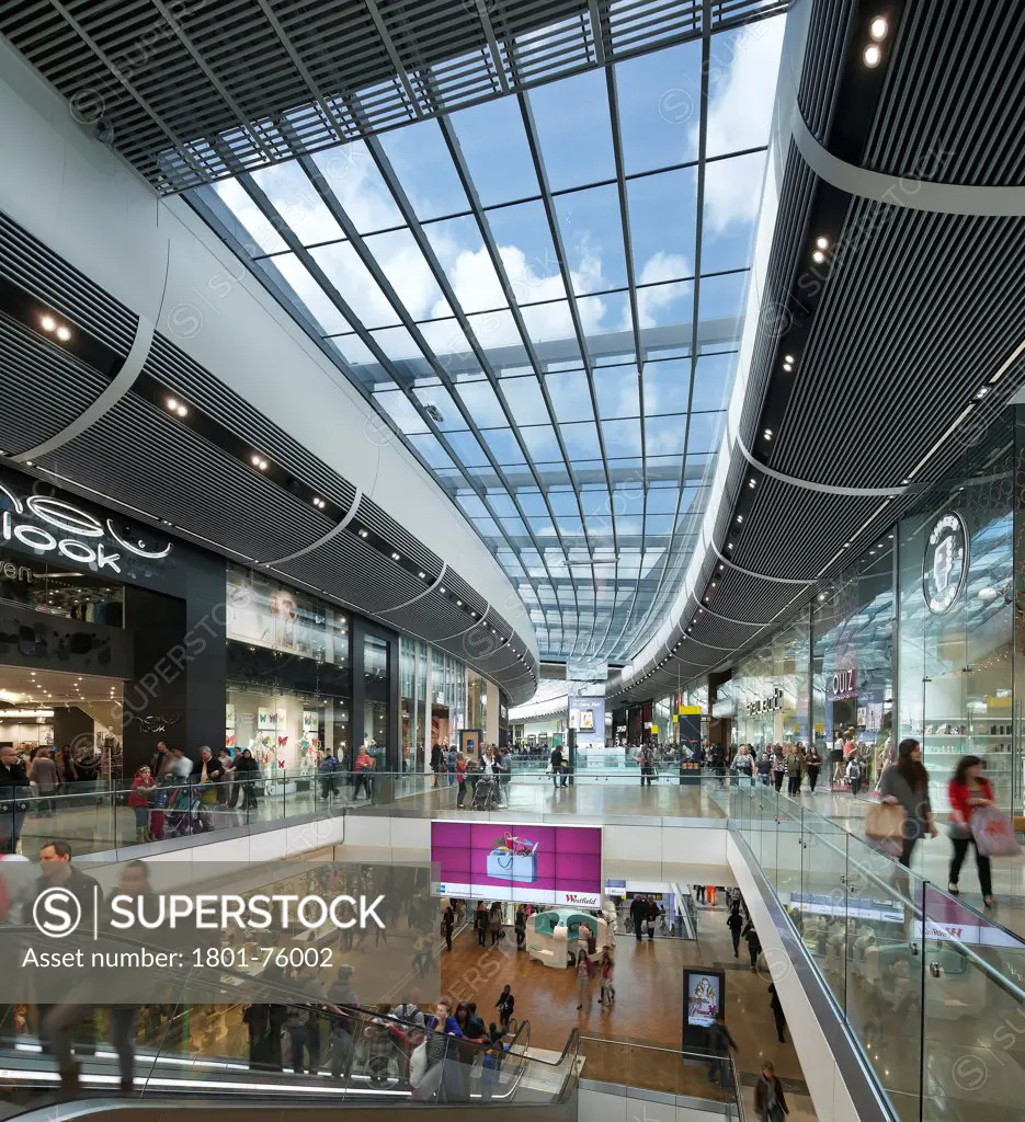 Westfield Shopping Centre Stratford, London, United Kingdom. Architect: Westfield Group, 2011. Mall interior with escalator.