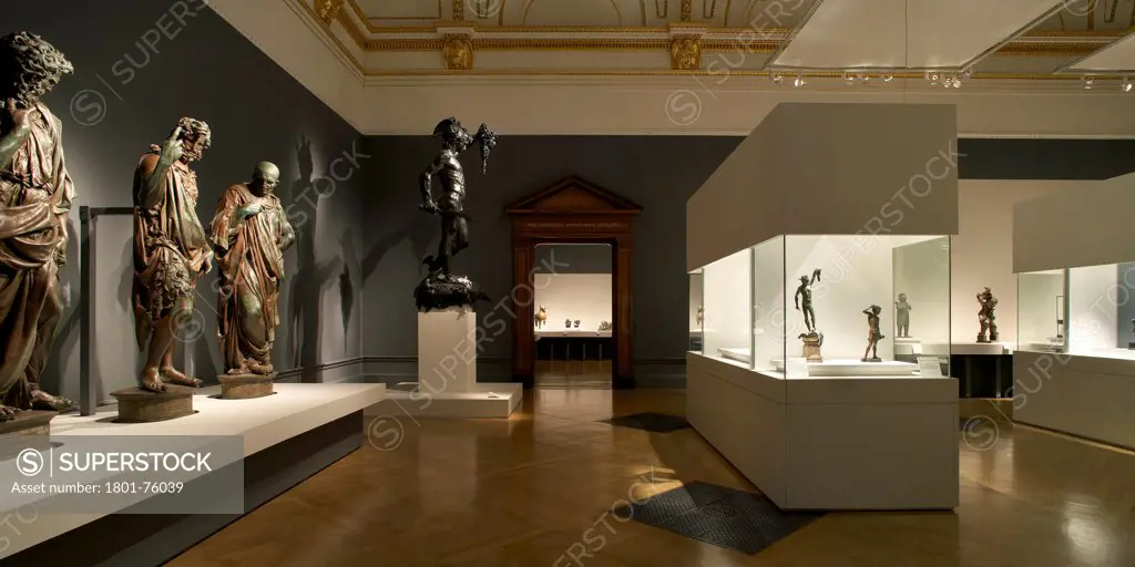 Royal Academy Bronze Exhibition, London, United Kingdom. Architect: Stanton Williams, 2012. Exhibition room with Italian Renaissance sculptures and illuminated display cases.