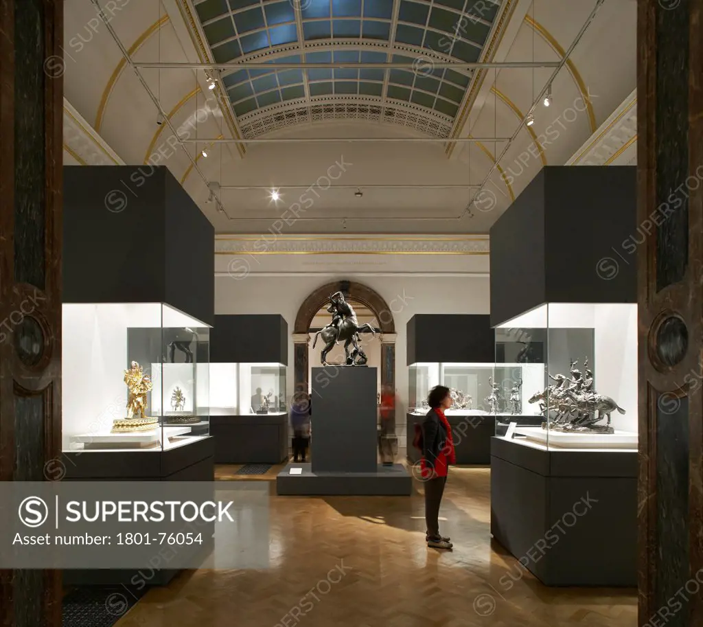 Royal Academy Bronze Exhibition, London, United Kingdom. Architect: Stanton Williams, 2012. Exhibition room with vaulted skylight ceiling and lit display cases.