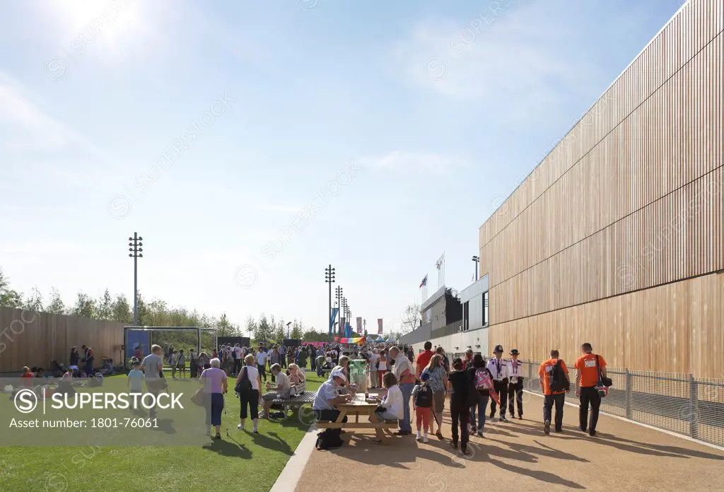 Eton Manor Olympic Park, London, United Kingdom. Architect: Stanton Williams, 2012. Facade perspective with circulating visitors.