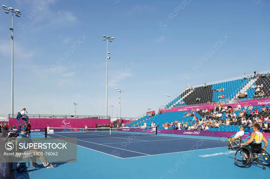 Eton Manor Olympic Park, London, United Kingdom. Architect: Stanton Williams, 2012. Tennis court during competition event.